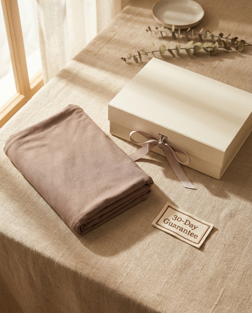 Vaelora jersey long khimar folded beside gift box with 30-day guarantee badge