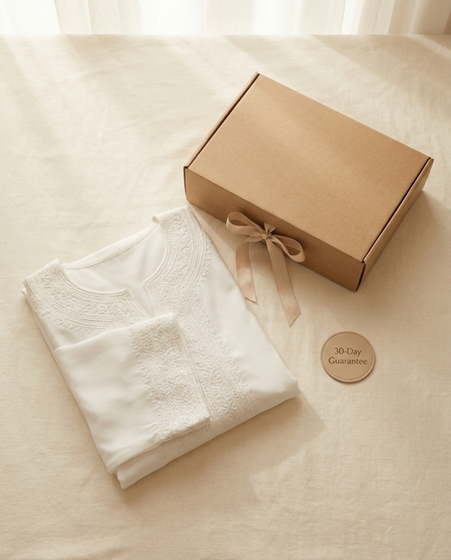 Vaelora white embroidered double-layer abaya folded flat-lay with giftbox and 30-day guarantee badge