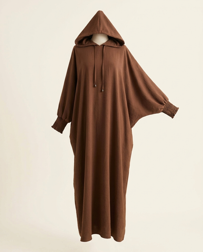 Brown hooded abaya dress with batwing sleeves and drawstring hood on invisible mannequin