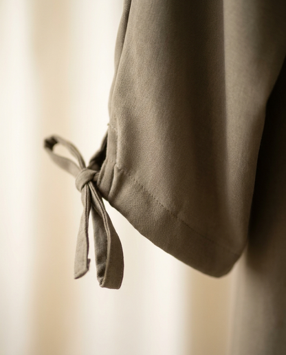 Close-up of smooth matte fabric and sleeve tie of the Vaelora Dubai plain abaya