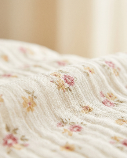 Close-up of soft floral print fabric of the Vaelora prayer dress